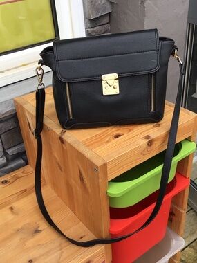 Danier Black Leather Crossbody with Gold Lock Detail Note: marks in lining